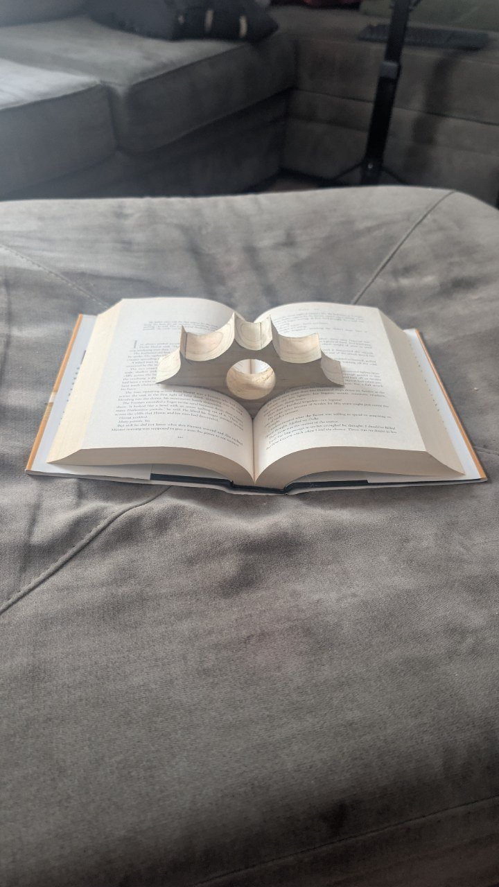 Hand-carved wooden bat book-page holder